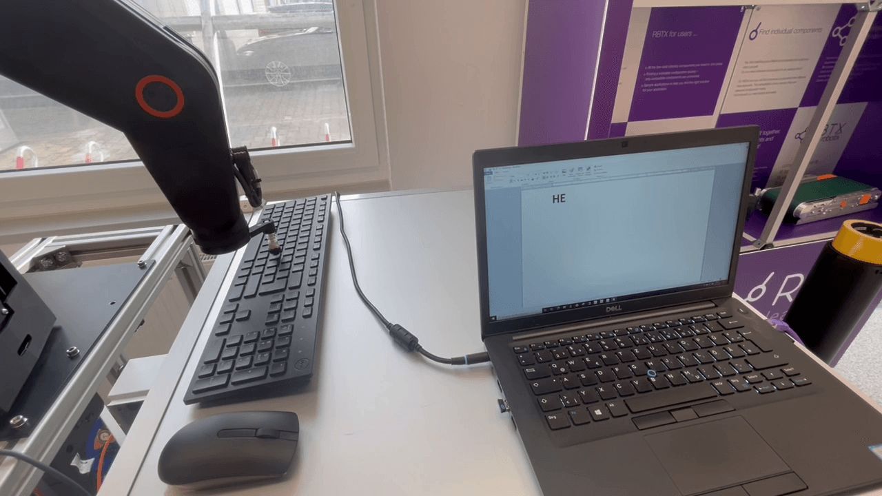 Five-axis robot tests keyboard